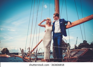 Stylish Wealthy Couple On A Luxury Yacht 