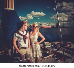 stylish wealthy couple on yacht 260nw 316111190