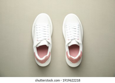 Stylish White Sneakers On Grey Background, Top View