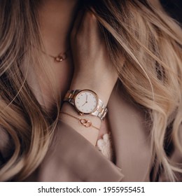 Stylish white watch on woman hand - Shutterstock ID 1955955451