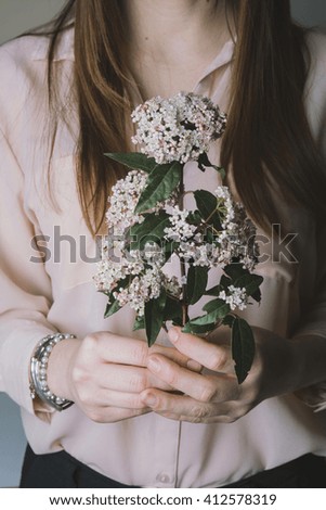 Similar – Hände einer Frau mit Blumenstrauß