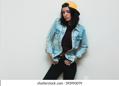 Stylish Woman In Jean Jacket And Yellow Cap. 