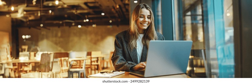 Stylish woman manager freelancer working on laptop while sitting in cozy cafe. High quality photo - Powered by Shutterstock