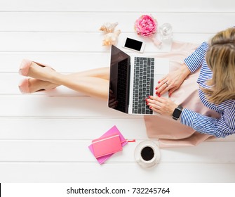 Stylish Woman Sitting On Floor And Using Laptop