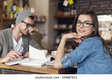 Stylish woman studying with her friend at cafe  - Powered by Shutterstock