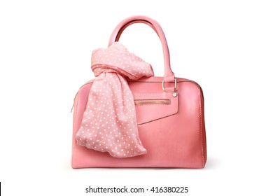 Stylish women's accessories. Beautiful set of women's handbag and scarf on a white background. Light pink, light coral