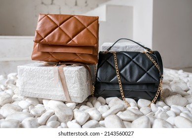 Stylish women's brown handbag. Trendy outfit woman with brown bag. Girl with bag over his shoulder outdoors. Shoulder Bags for Women. Fashion look woman outfit. Close-up.