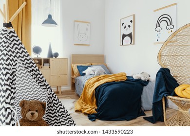 Stylish Wooden Commode In Bright Bedroom Interior With Poster On The Wall