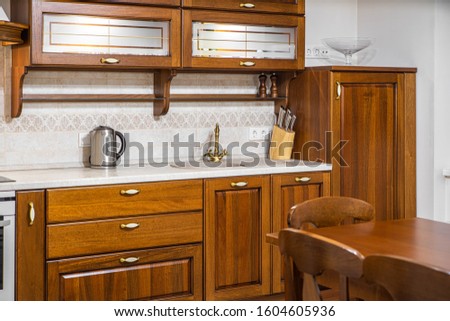 Stylish wooden kitchen set. Luxury interior of kitchen. Close-up.