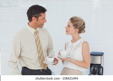 Stylish Workmates Having Coffee Together In Break Room