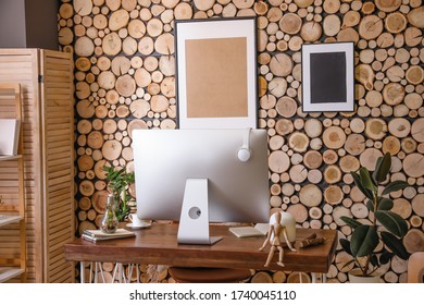 Stylish workplace with modern computer in interior of room