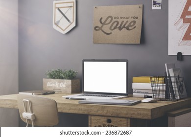 Stylish workspace with computer and posters on home or studio - Powered by Shutterstock