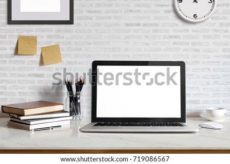 Stylish workspace with laptop computer, office supplies gadget at home or studio office. Desk space Mock up blank screen for graphic montage.