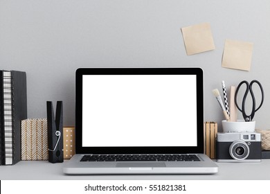 Stylish workspace with mac, laptop computer, office supplies, camera, sticky notes at home or studio