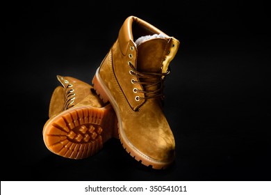 Stylish Yellow Nubuck Mens Boots On Black Background, Advertising Concept