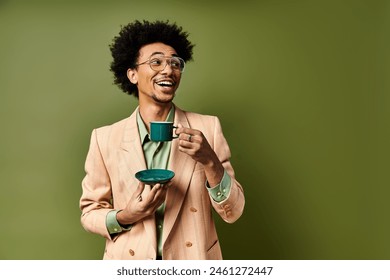 A stylish young African American man in a suit and sunglasses, holding a cup of coffee against a green background. - Powered by Shutterstock