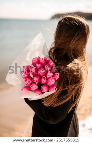 Similar – Woman arranges luxury bouquet of flowers