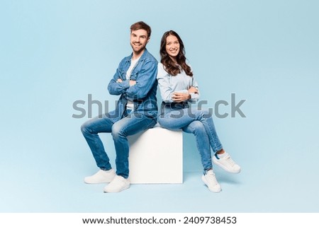 Similar – Image, Stock Photo A fashionable couple, dressed in white and wearing avant-garde shoes, is having some fun in the green meadow. With a cow. It’s a great outdoor wanderlust at its best. On a wild summer night.