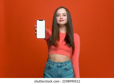 Stylish Young Girl Customer Showing Modern Mobile Phone With Blank Mockup Screen Copy Space For App Advertising