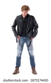 Stylish Young Man In Biker Or Rocker Clothes Searching For Lost Item In Jeans Pockets. Full Body Length Isolated On White Background. 