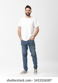 Stylish Young Man In Jeans On White Background