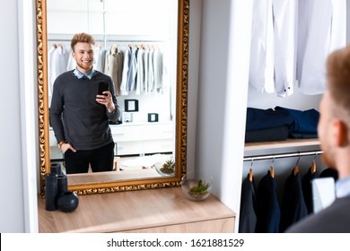 Stylish Young Man Taking Selfie In Dressing Room