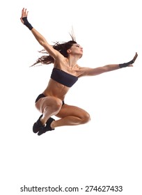 Stylish and young modern style dancer jumping.