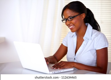 Stylish Young Woman With Black Glasses Working On Laptop At Workplace - Copyspace