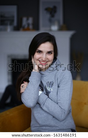 Stylish young woman in a cheerful mood