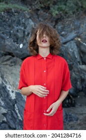 Stylish Young Woman In A Vintage Red Dress Of Sixties Lifestyle.	