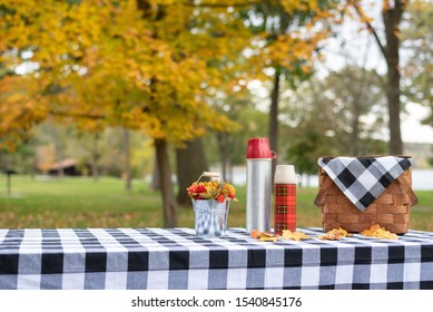 Stylishly Decorated Picnic Table On A Fall Day At The Lake