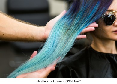 Stylist Demonstrates His Work With Beautiful Girl. Barber Haircut Dyed Hair Color Blue.