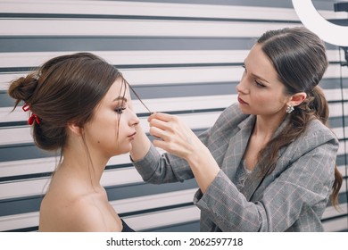 Stylist Doing Hairstyle For Beautiful Teenage Girl. Hairstyle, Beauty Standards, Fashion Concept. Close Up Shot.