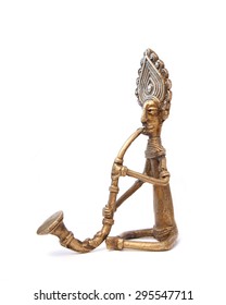 stylized bronze figurine of a man playing a musical instrument
