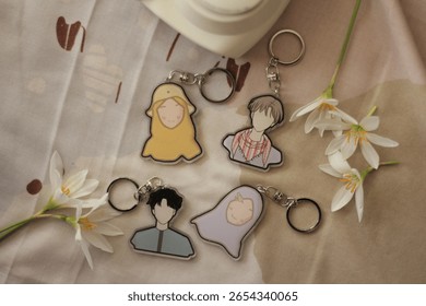 Stylized Flat Design Keychains Featuring Abstract Human Figures Still Life