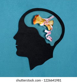 Stylized Head Silhouette. Brain With Apple Stub In Measuring Tape. Pathological Food Restriction. Anorexia Nervosa. Concept Of Mental Health And Disease