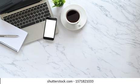 Stylized Marble Office Desk Flat Lay Laptop, Pen, Notebook, Coffee With Plant And Mockup Phone On Top View Copy Space.