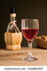 Stylized Wine Glass On Wooden Base