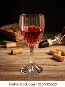 Stylized Wine Glass On Wooden Base