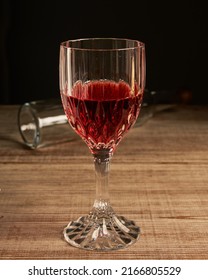 Stylized Wine Glass On Wooden Base