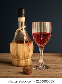 Stylized Wine Glass On Wooden Base