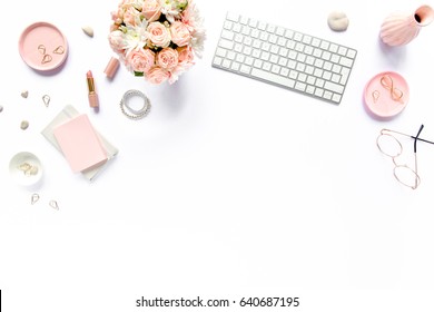 Stylized women's desk, office desk. Workspace with, laptop, bouquet roses, clipboard. Women's fashion accessories isolated on white background. Flat lay Top view - Shutterstock ID 640687195