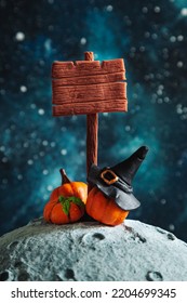 Stylized Wooden Signpost, Witch Hat And Pumpkins On The Moon. Mockup. Halloween Background. 