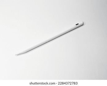 stylus pen over the phone screen to draw  isolated white background 