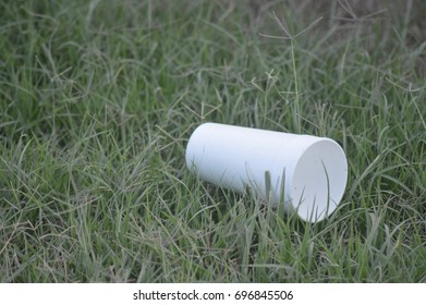 Styrofoam Cup In Grass