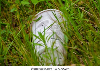 Styrofoam Cup Litter Found With Grasses Growing Around It In Prairie Of The Crex Meadows Wildlife Area