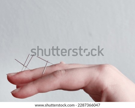 Similar – Image, Stock Photo Resilience, enduring pain, needles from a conifer stuck in your hand