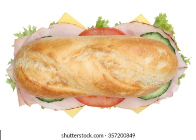 Sub Deli Sandwich Baguette With Ham, Cheese, Tomatoes And Lettuce Top View Isolated On A White Background