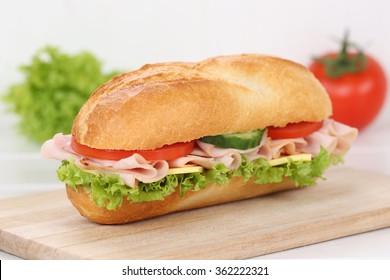 Sub Deli Sandwich Baguette With Ham, Cheese, Tomatoes And Lettuce For Breakfast