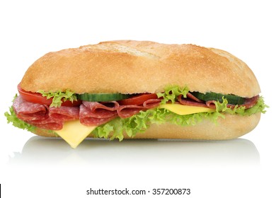 Sub Deli Sandwich Baguette With Salami, Cheese, Tomatoes And Lettuce Side View Isolated On A White Background